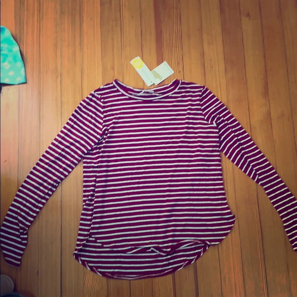 A maroon an white top